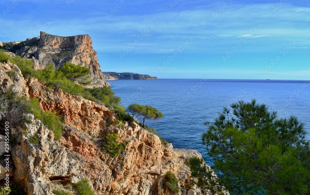 Beautiful beach in Spain with steep cliffs.