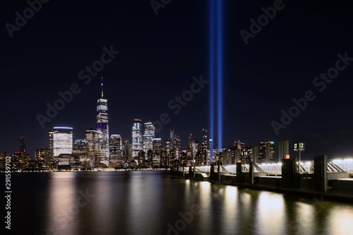 Jersey City, NJ - USA - Aug 30 2019: The 9/11 Tribute in Lights temporary monument in lower Manhattan New York City view from New Jersey