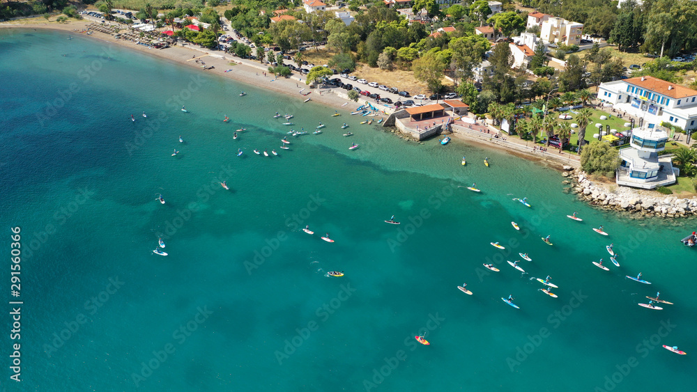 Aerial bird's eye view photo taken by drone of stand up paddle surfers in annual SUP crossing competition in Corinth Canal, Greece