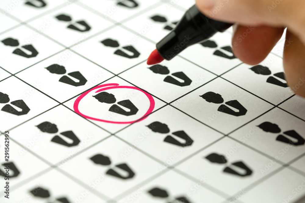 Businessman hand marked red on the person icon with a pen on white paper, Recruitment business, Human resources concept. Businessman hand marked red on the person icon with a pen on white paper, Recruitment business, Human resources concept.