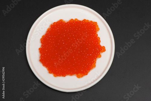 Red caviar in a saucer