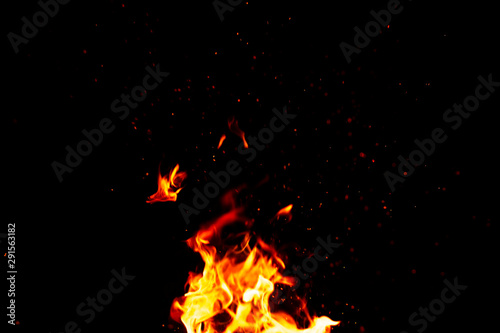 fire and sparks, from a campfire on a dark night background, front and background blurred