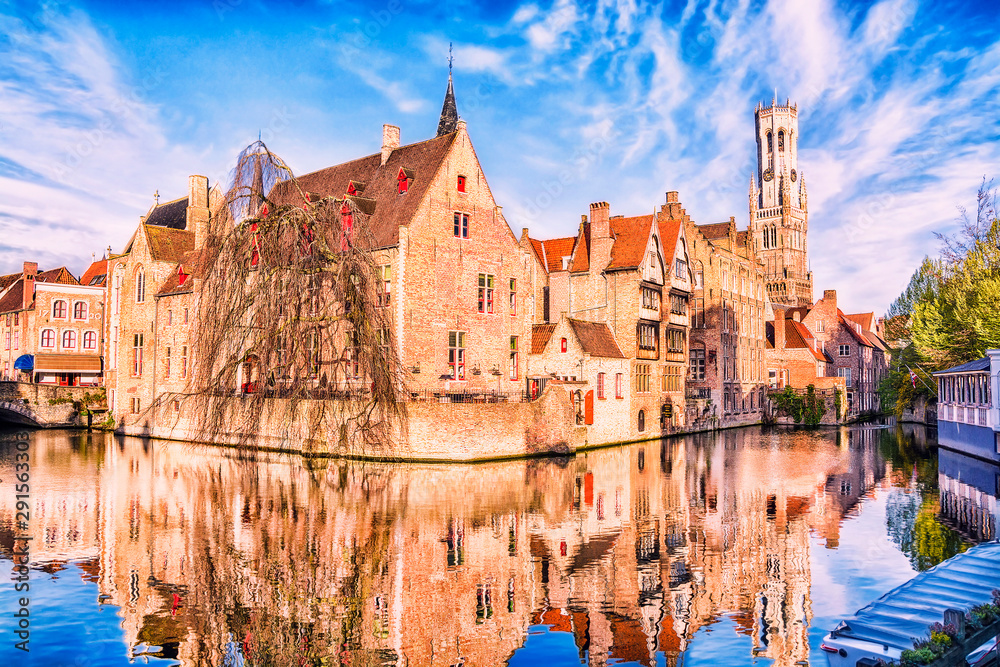 Fototapeta premium View of canal, tower Belfort and houses in medieval fairytale town Bruges at morning, Belgium