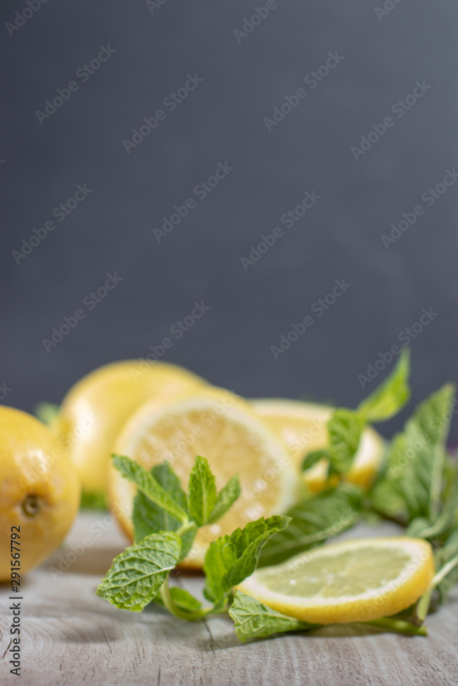 Lemons with Mint on Wood Plate