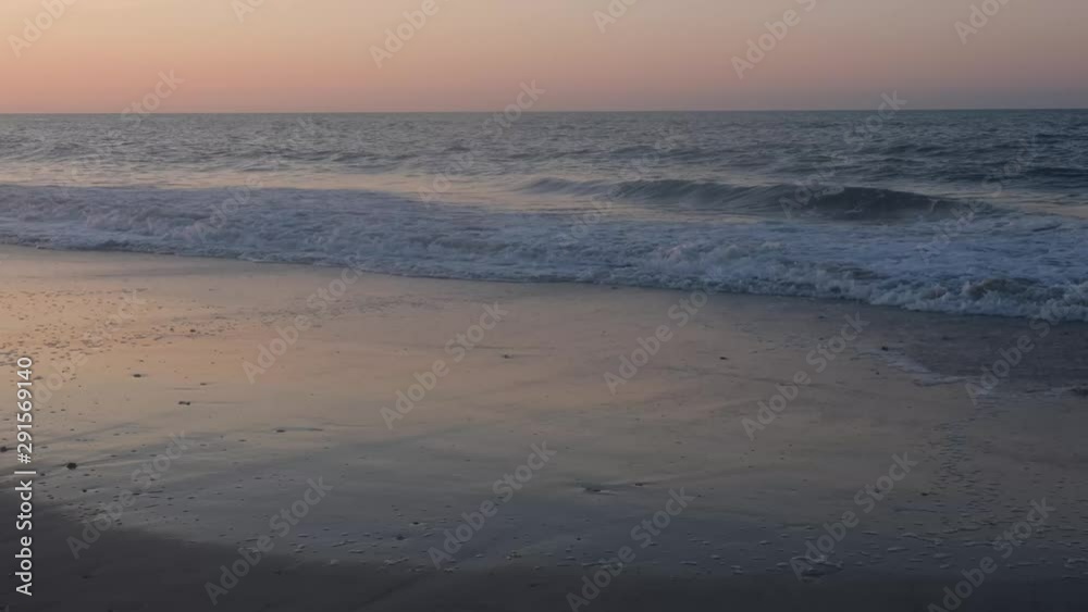 Beautiful sunrise and ocean side scenery at Topsail Beach, a vacation community by the Atlantic ocean in North Carolina, USA Beautiful sunrise and ocean side scenery at Topsail Beach, a vacation community by the Atlantic ocean in North Carolina, USA