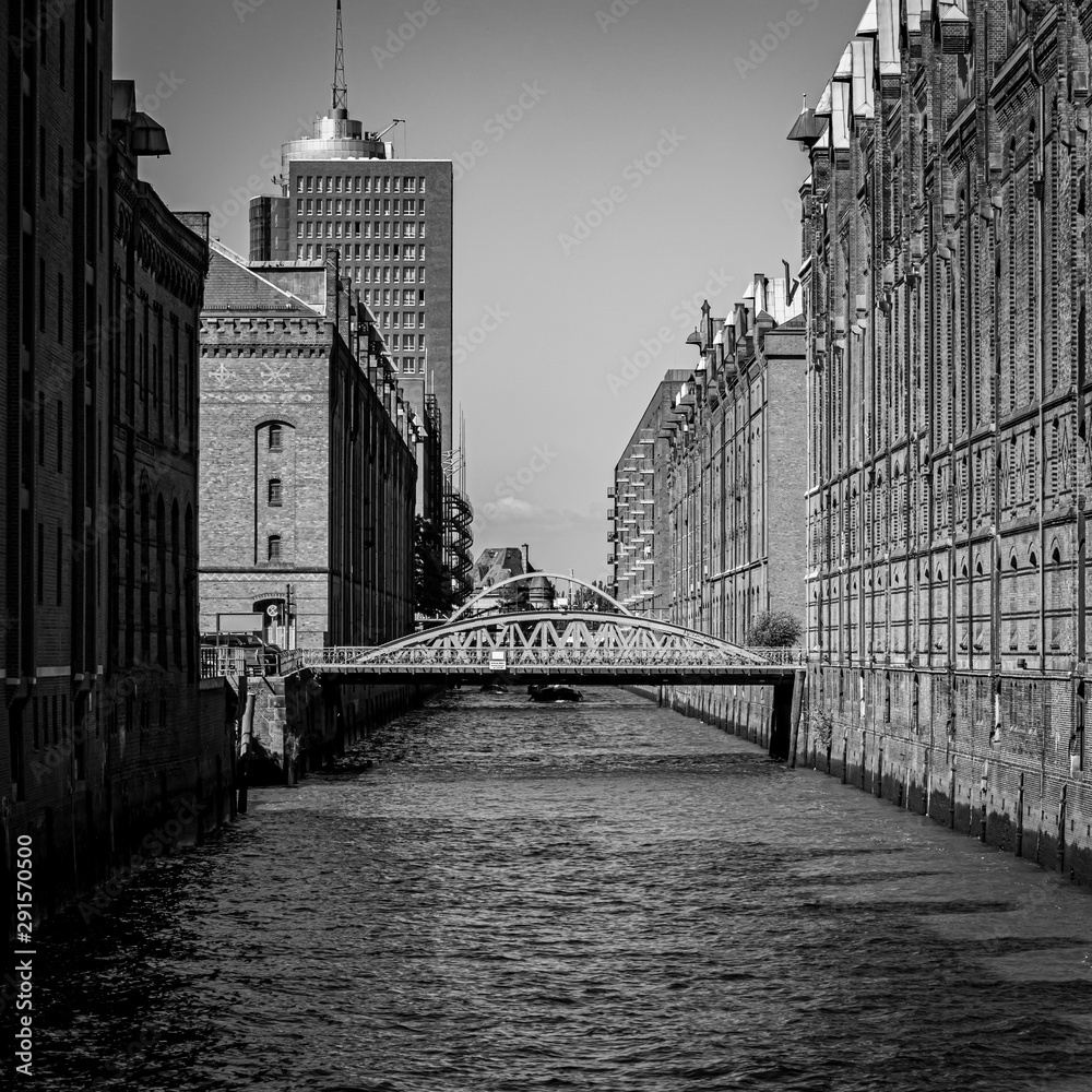 The Old storage house area at the port of Hamburg known as „Speicherstadt“  - obrazy, fototapety, plakaty 