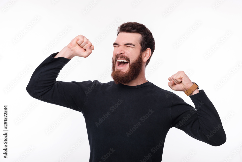 Photo of young happy man celebrating success Photo of young happy man celebrating success