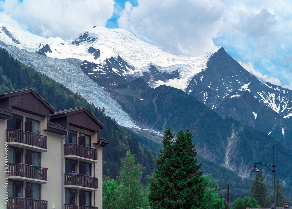 Chamonix-Mont-Blanc, Haute-Savoie / France - July 2nd, 2019: The Mont Blanc seen from the center of the town in summer