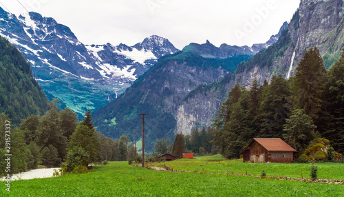 Switzerland. Alpine landscape in Grindelwald with snowy mountains in summer