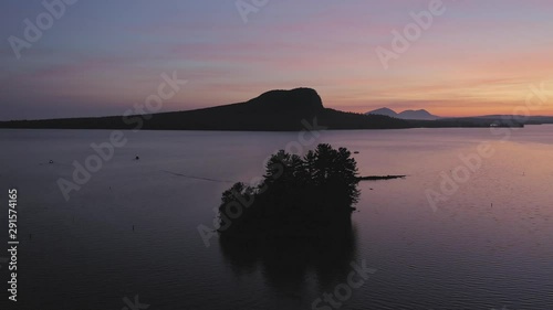 Spectacular sunrise beyond Mount Kineo at Moosehead Lake photo