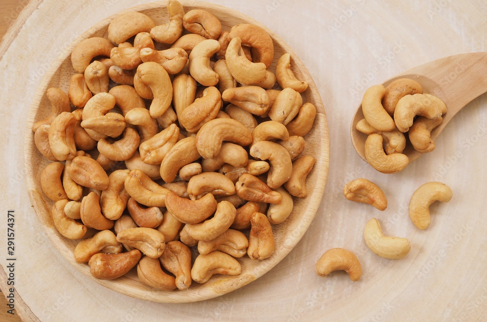 Cashew nuts on a wooden spoon Cashew nuts on a wooden spoon