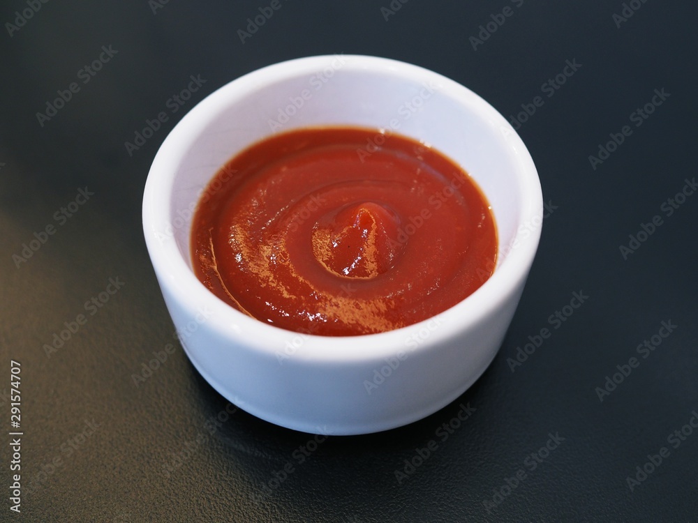 Top view of Chili sauce or tomato sauce to add flavor isolated on black background. Top view of Chili sauce or tomato sauce to add flavor isolated on black background.