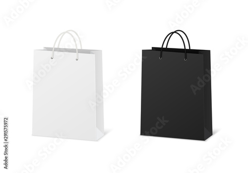Blank shopping paper bags mockup. Empty cardboard packets on white background. photo