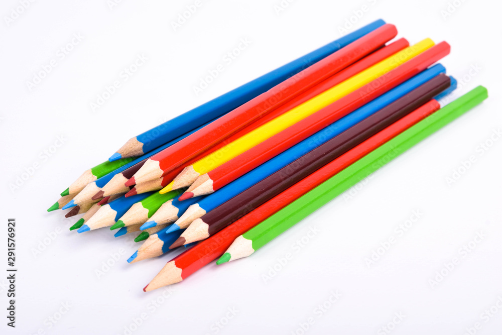 Many different colored pencils on a white background with a place for text and cory space . Many different colored pencils on a white background with a place for text and cory space .