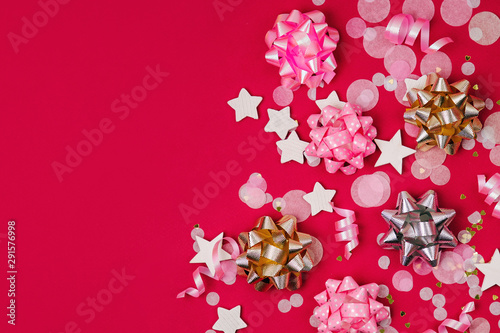 Confetti  bows and paper decorations. Valentines day or birthday party concept theme. Flat lay  top view.