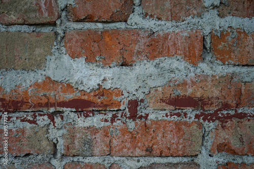 Grunge dirty old brick stone wall. construction of warm brick houses.