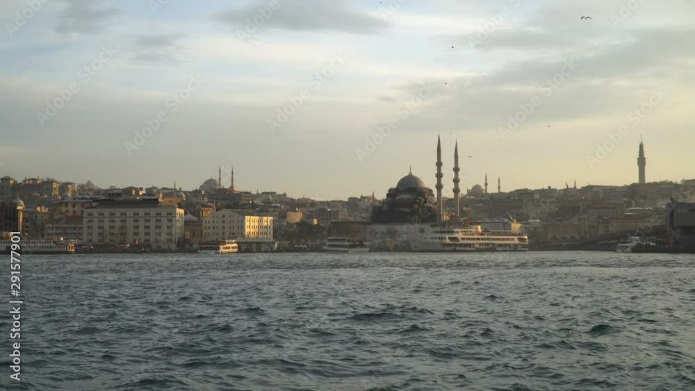The New Mosque with The Beyazit Tower and The Galata Bridge at Istanbul The New Mosque with The Beyazit Tower and The Galata Bridge at Istanbul