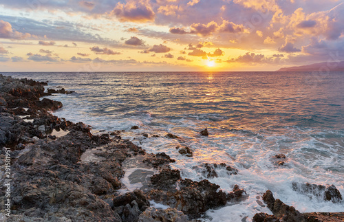 Beautiful summer sunrise with sunrays on Greek island Crete.