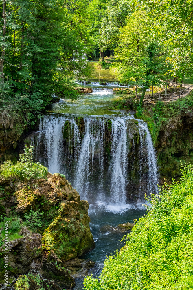 Waterfalls of Korana river in Rastoke village,near Slunj, Croatia, beautiful landscape with green trees on sunny summer day Waterfalls of Korana river in Rastoke village,near Slunj, Croatia, beautiful landscape with green trees on sunny summer day