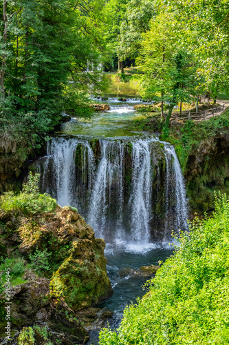 Waterfalls of Korana river in Rastoke village,near Slunj, Croatia, beautiful landscape with green trees on sunny summer day