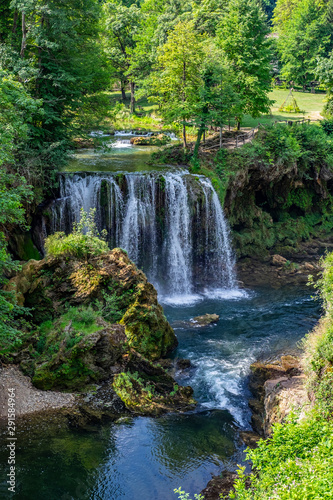 Waterfalls of Korana river in Rastoke village, near Slunj, Croatia, beautiful landscape with green trees on sunny summer day
