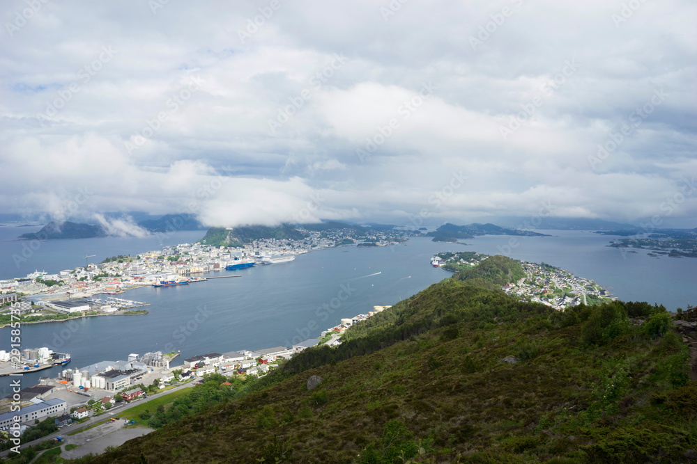 Alesund is a port and tourist city at the entrance to the Geirangerfjord. Cityscape image of Alesund at dawn.