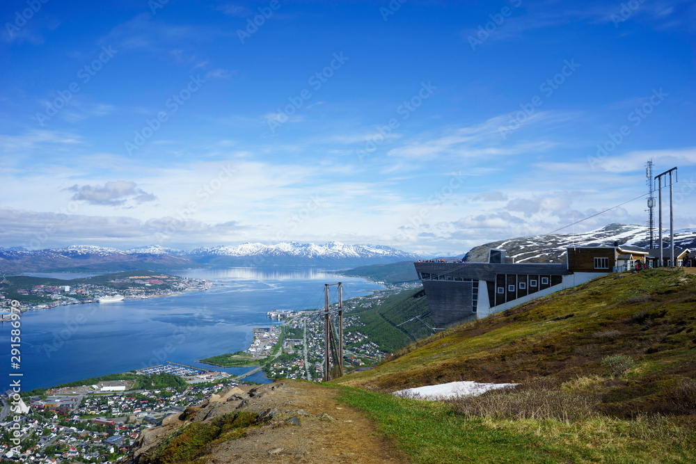 Tromso, Norway with bridge and cruise ship in foreground and airport in background Tromso, Norway with bridge and cruise ship in foreground and airport in background
