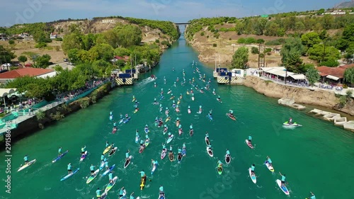 Aerial bird's eye view video taken by drone of stand up paddle surfers in annual SUP crossing competition in Corinth Canal, Greece photo