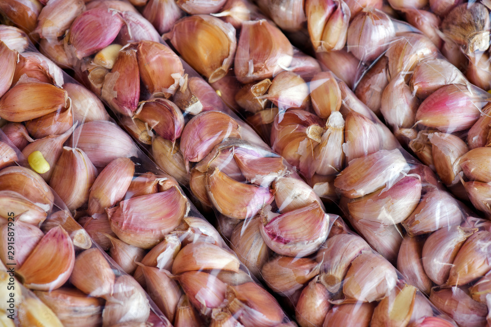 Closeup of bunch of unpeeled garlic