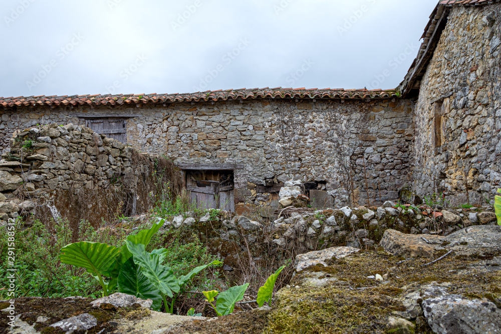 Abandoned stone farm without roof and vegetation in northern Spain, Europe Abandoned stone farm without roof and vegetation in northern Spain, Europe