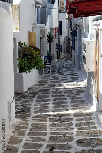 White painted paved back street in Mykonos old town  Greek Islands