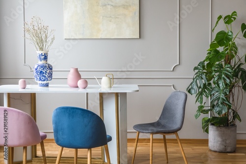 Abstract painting on empty wall of classy living room interior