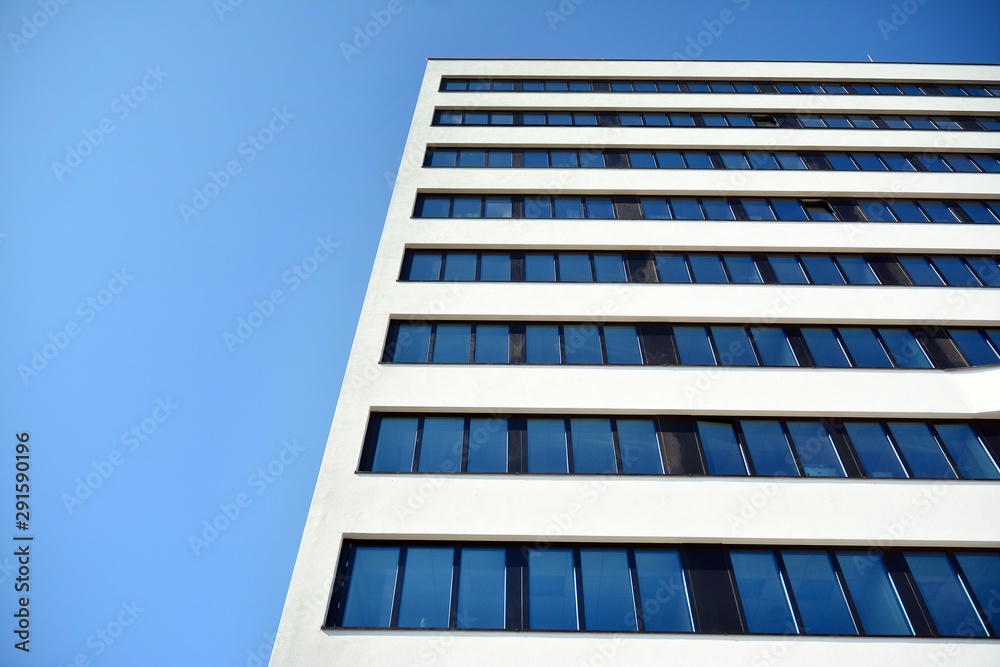 Facade fragment of a modern office building. Exterior of glass wall with abstract texture. Facade fragment of a modern office building. Exterior of glass wall with abstract texture.