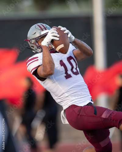 Great action photos of high school football players making amazing plays during a football game