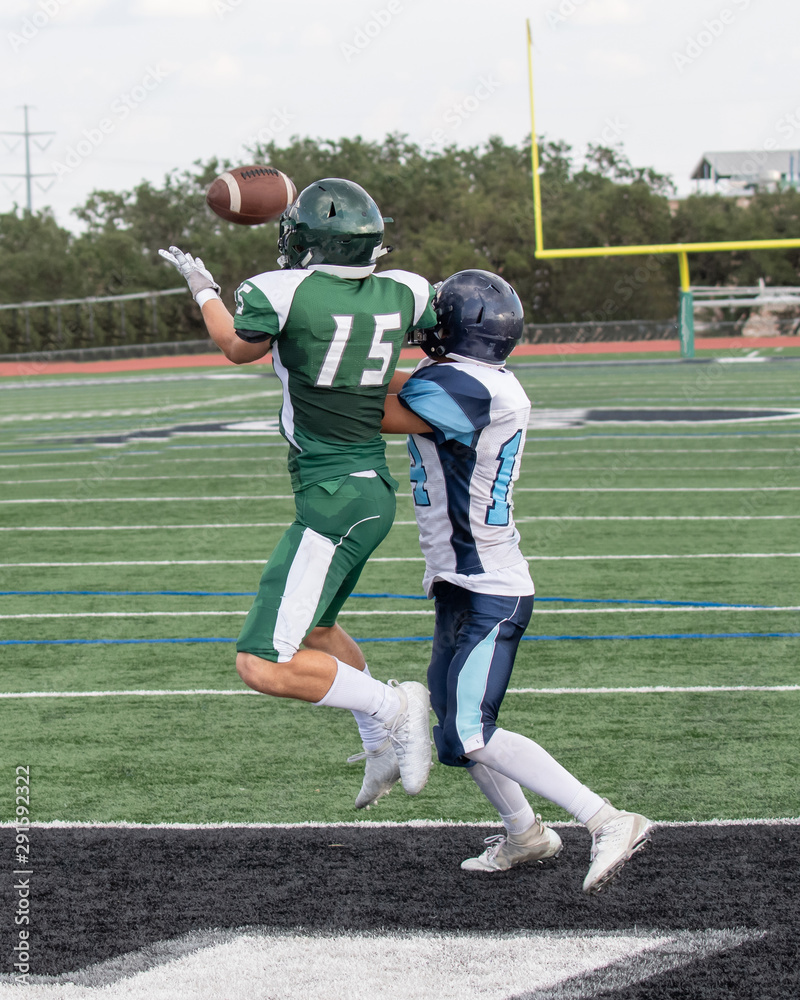 Fototapeta premium Great action photos of high school football players making amazing plays during a football game
