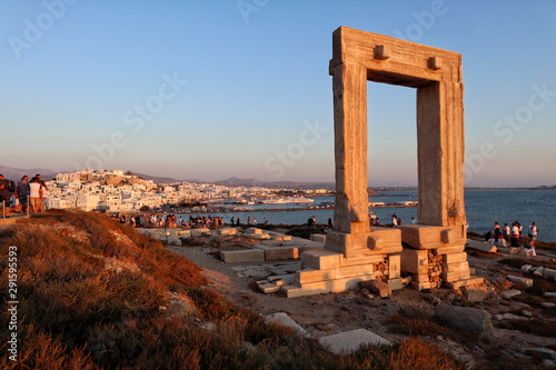 Sunset at Naxosos Portara, Apollo's 6th Cent BC temple ruins, overlooking Naxos town, Greek Islands 