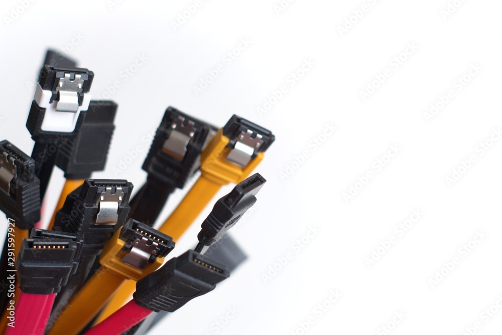Red, black and yellow computer data cables. Data storage, network server infrastructure concept. Plenty of negative space. Red, black and yellow computer data cables. Data storage, network server infrastructure concept. Plenty of negative space.