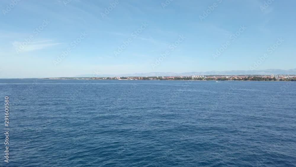 A side view of the calm sea from the moving ship/vessel/yatch, showing deep blue sea water and horizon.Concept of transportation,export,import,travel(1) A side view of the calm sea from the moving ship/vessel/yatch, showing deep blue sea water and horizon.Concept of transportation,export,import,travel(1)