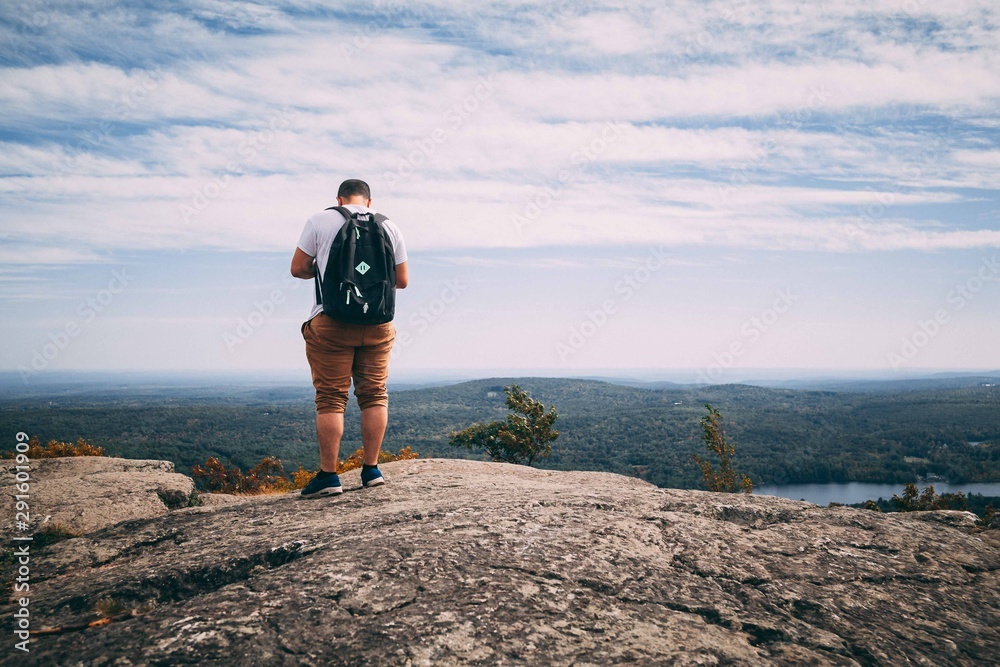 hiker on the top of mountain