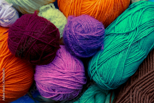 Colorful yarn balls as background, close up