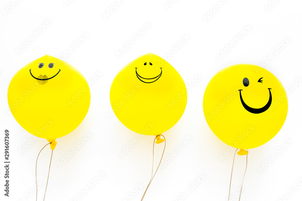 Naklejka Happiness emotion. Yellow balloon with smile on white background top view