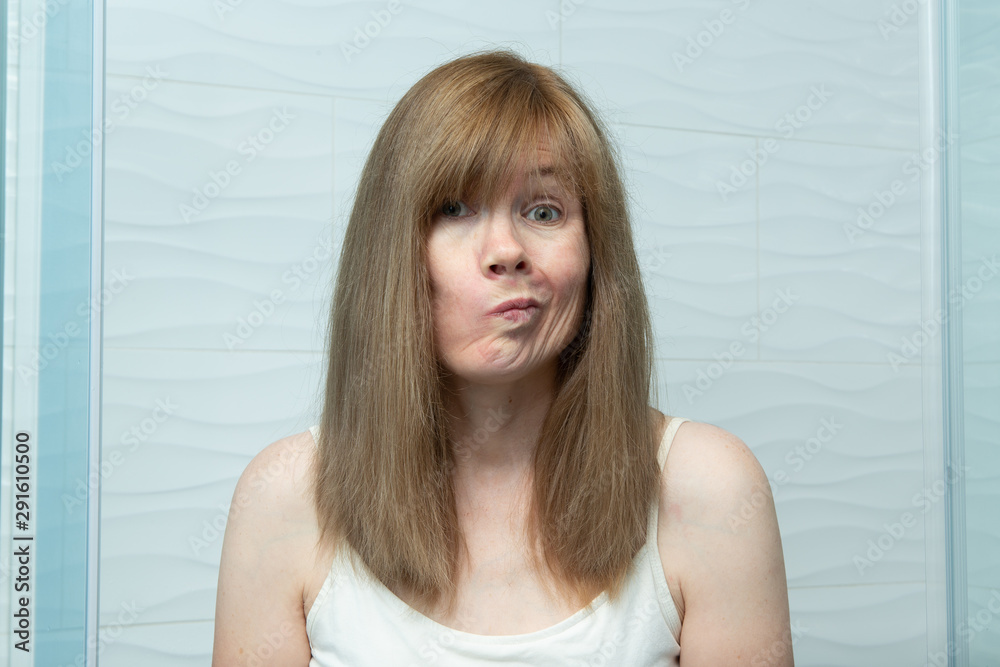 Middle aged woman making silly expression Middle aged woman making silly expression