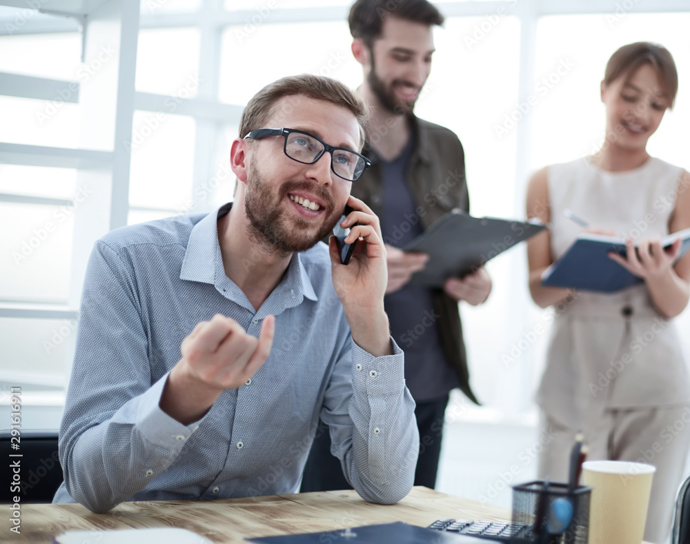 business man talking to a client on a smartphone