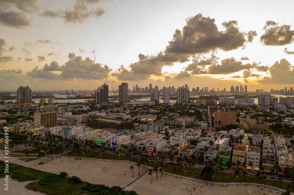 Fototapeta premium Tourism Miami Beach Ocean Drive aerial drone photo with moody sky