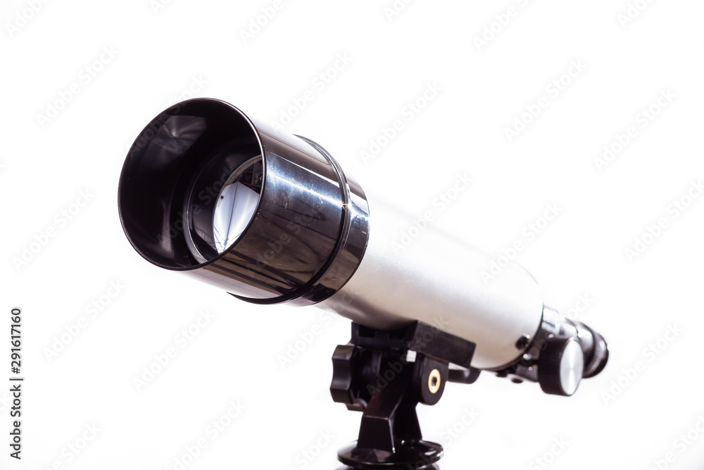 telescope on a white background laid on wooden board