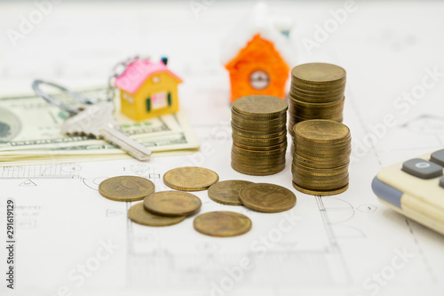 Planning savings money of coins to buy a home concept for property.