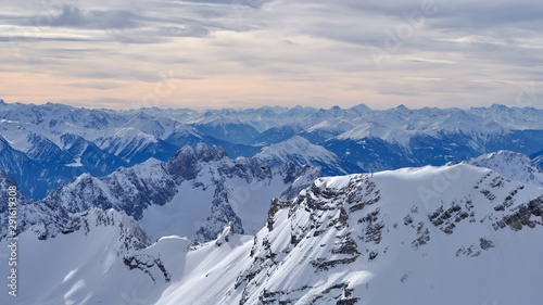  Alpine mountains at sunset from the top of the Zugspitze peak, Germany.  It lies south of the town of Garmisch-Partenkirchen. Panorama. © vadim_ozz