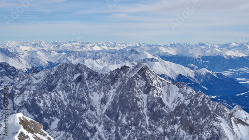 Panoramic view, Alpine mountains from the top of the Zugspitze peak, Germany. It lies south of the town of Garmisch-Partenkirchen.