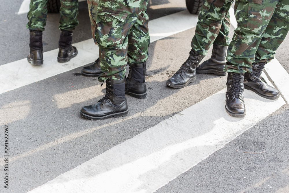 Legs of Many soldiers standing on the road Legs of Many soldiers standing on the road