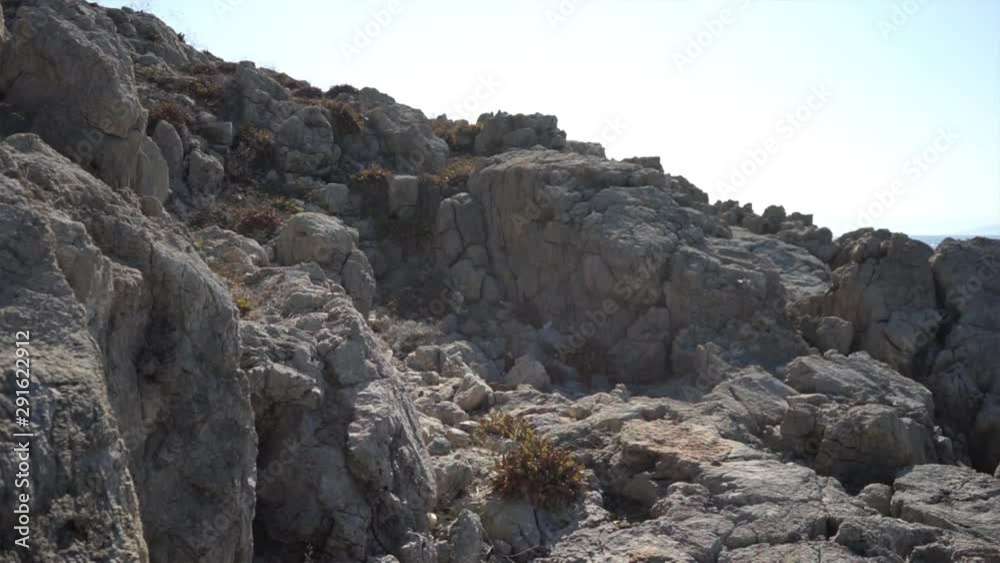 Stone, rocks and ocean water. Seashore with crashing sea waves. Stone, rocks and ocean water. Seashore with crashing sea waves.